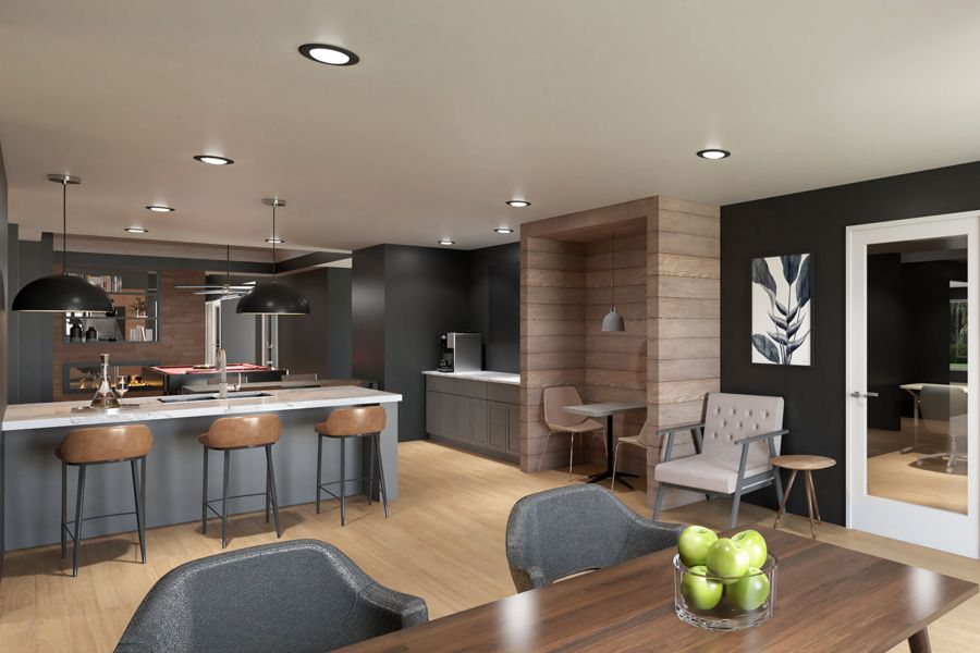 Attain on 5th apartment homes with Modern open-concept kitchen and dining area with wood accents and a bowl of green apples on the table.