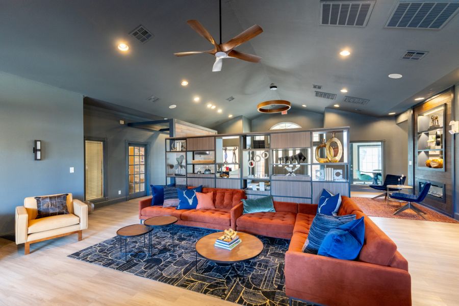 Attain on 5th apartment homes with Modern open-concept kitchen and dining area with wood accents and a bowl of green apples on the table.