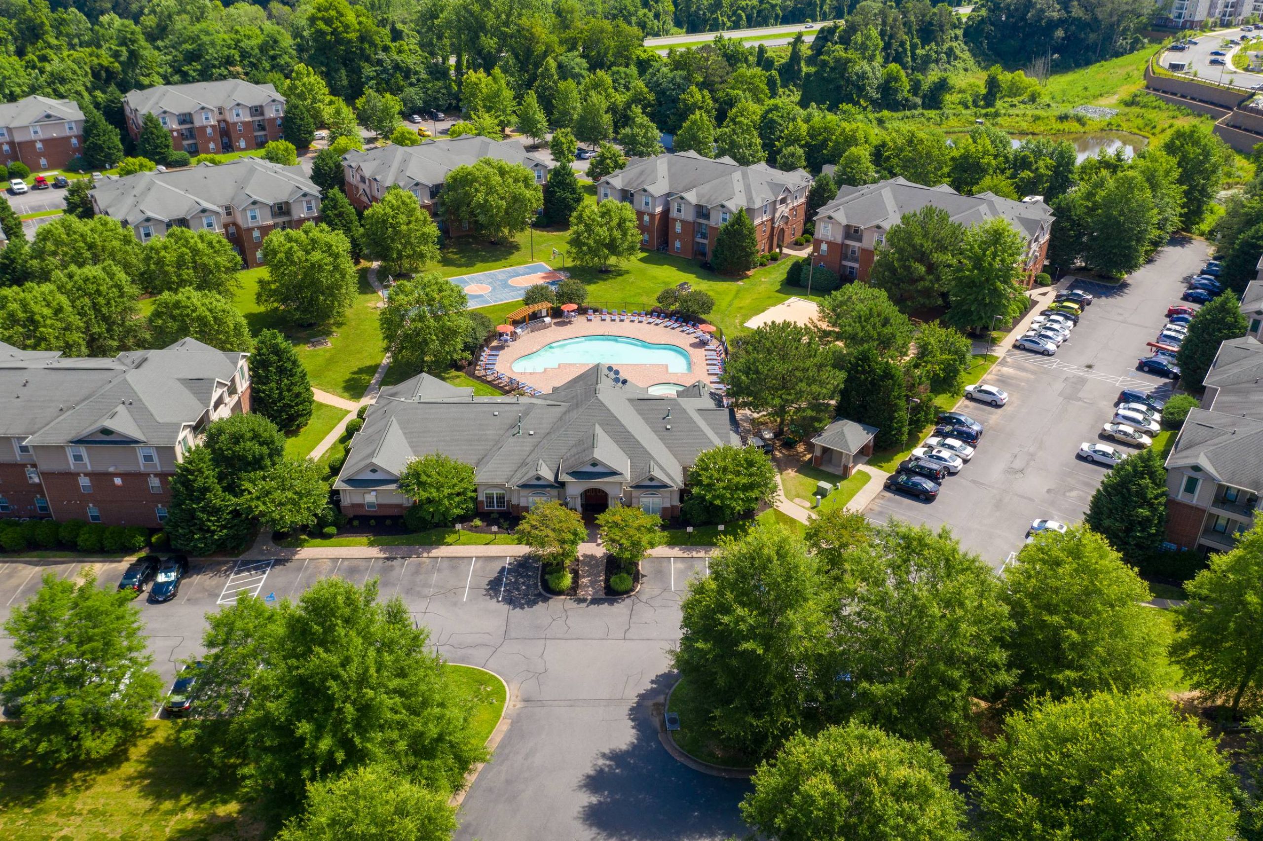 Attain on 5th aerial of property residential buildings, clubhouse, and pool